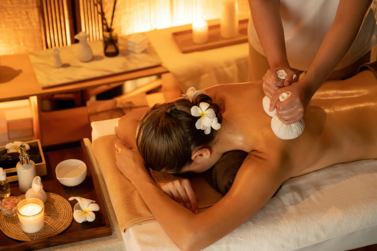 Abhyanga oil massage with warm herbal leaf ElaKizhi bolus bags